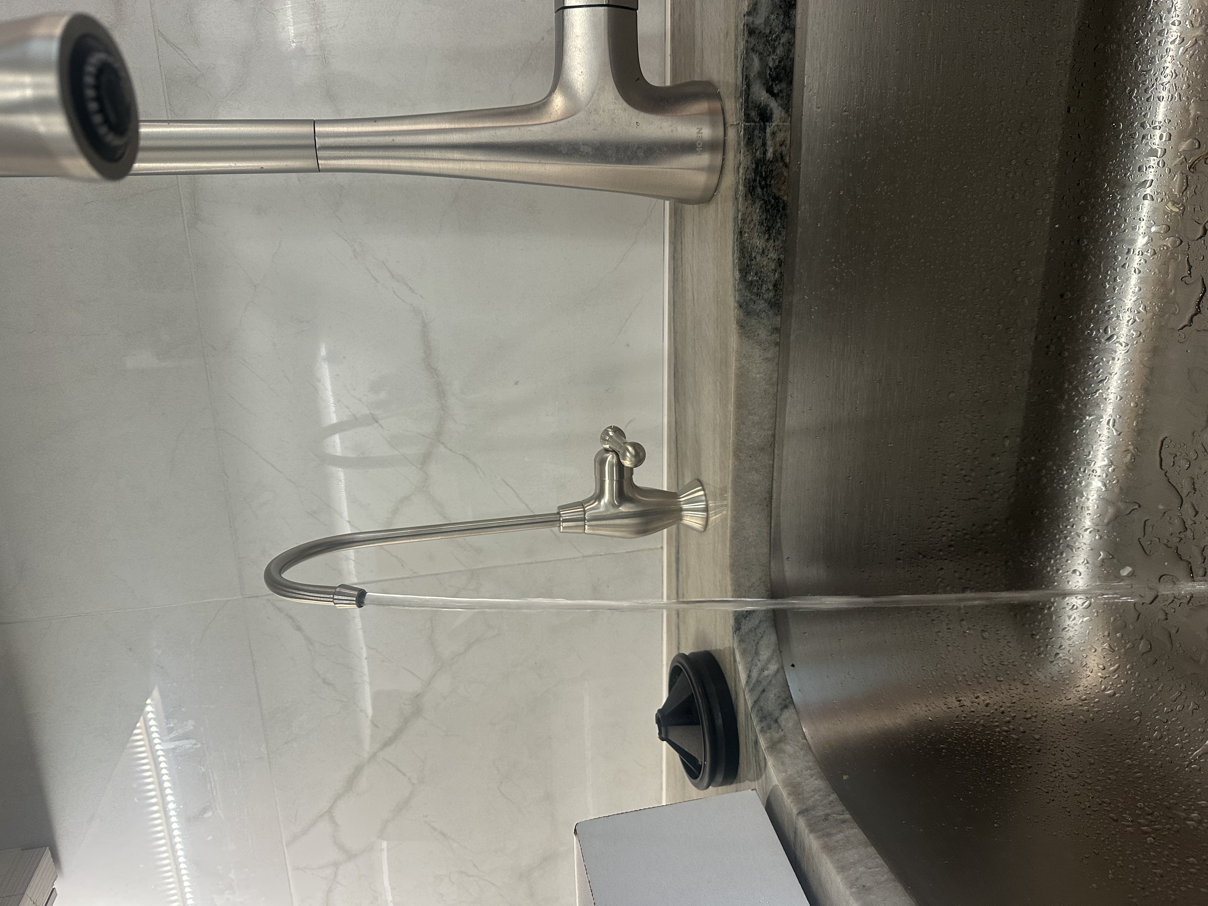 Integrity Plumbing technician performing faucet repair